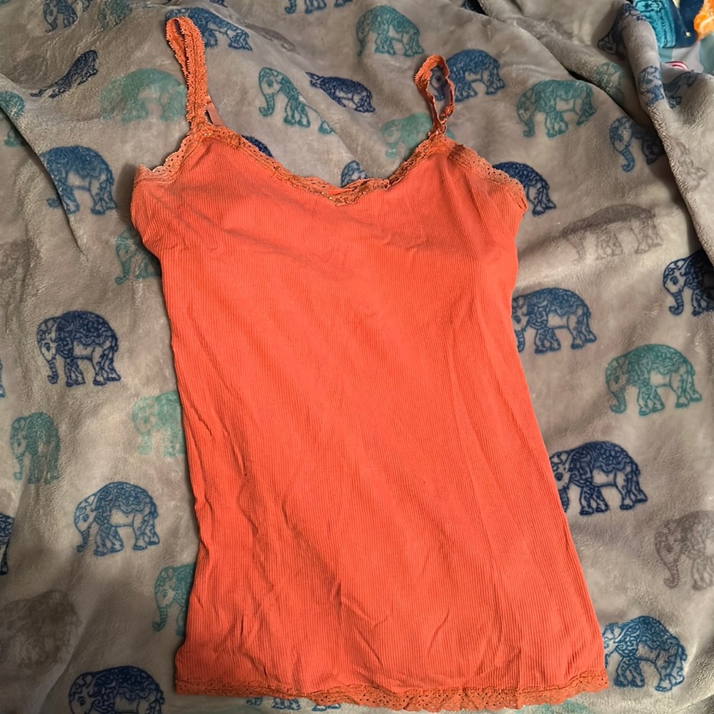 Used but in good condition. Size medium. More coral in color then orange.